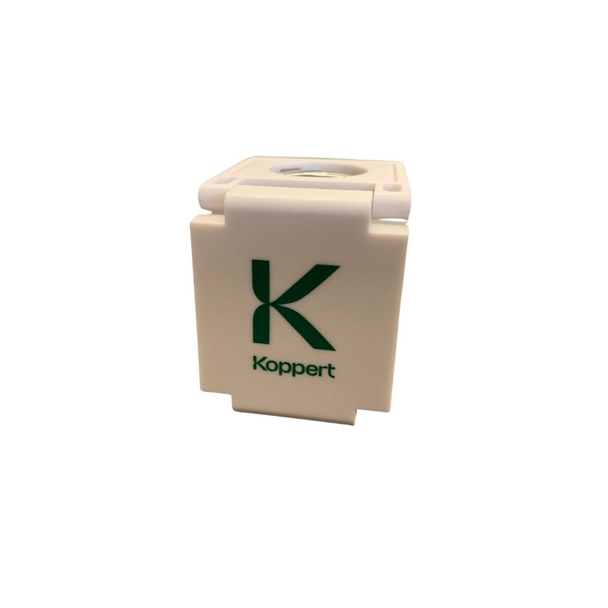 A white plastic magnifying lens with a scale, featuring the brand name 'Koppert' on the lens.