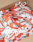 hundreds of spidex vital plus sachets in a brown cardboard box