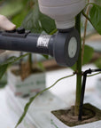 black trianum-g tool being used on plants